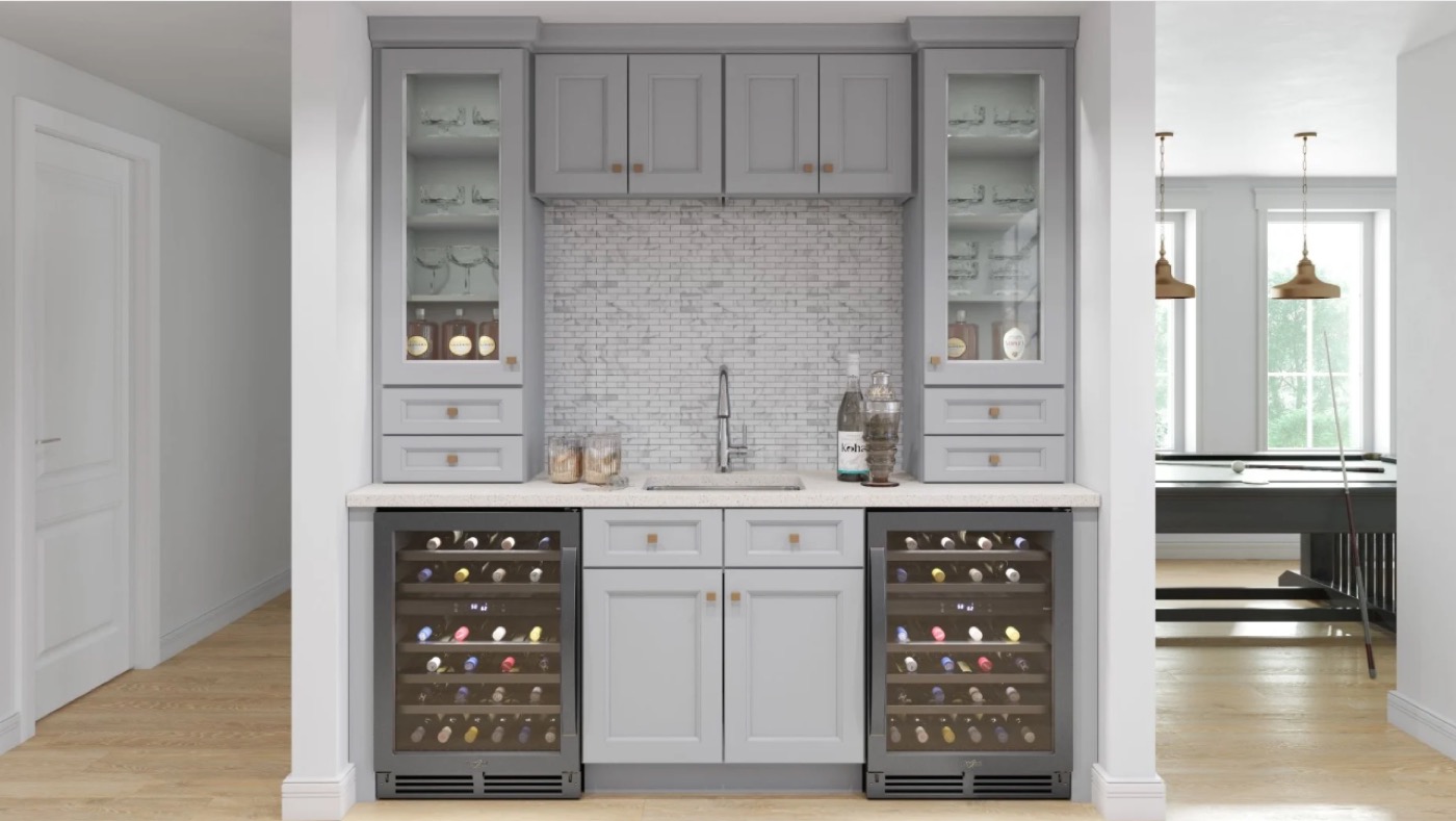 Grey wet bar with glass-front cabinets and dual wine coolers by Create More Space