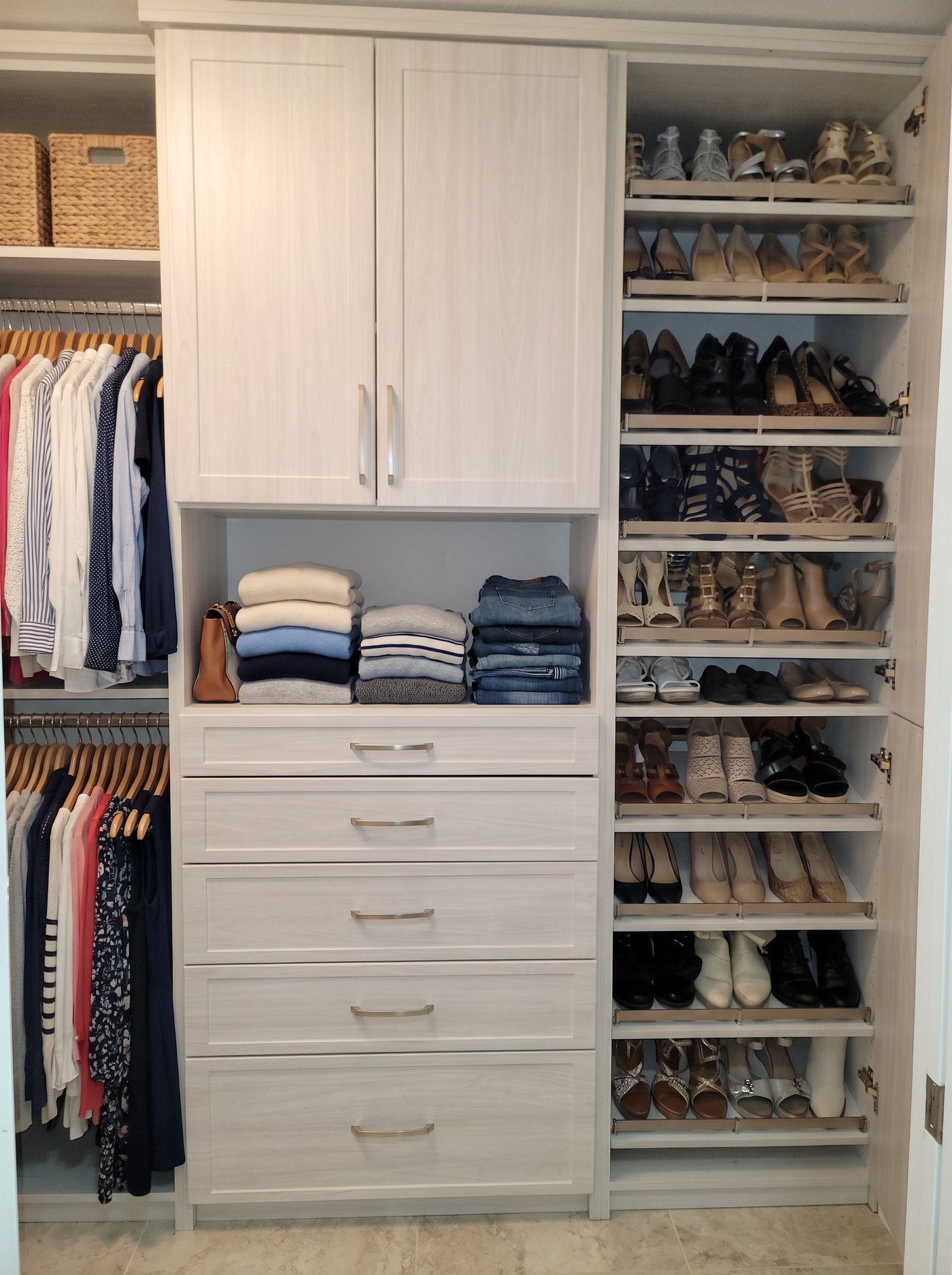 Reach-in closet with shoe cubbies and adjustable shelving