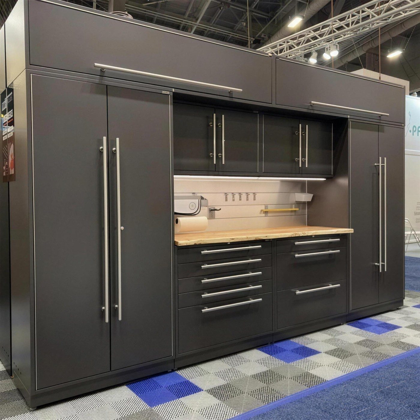 Charcoal metal garage cabinetry with butcher-block top by Create More Space