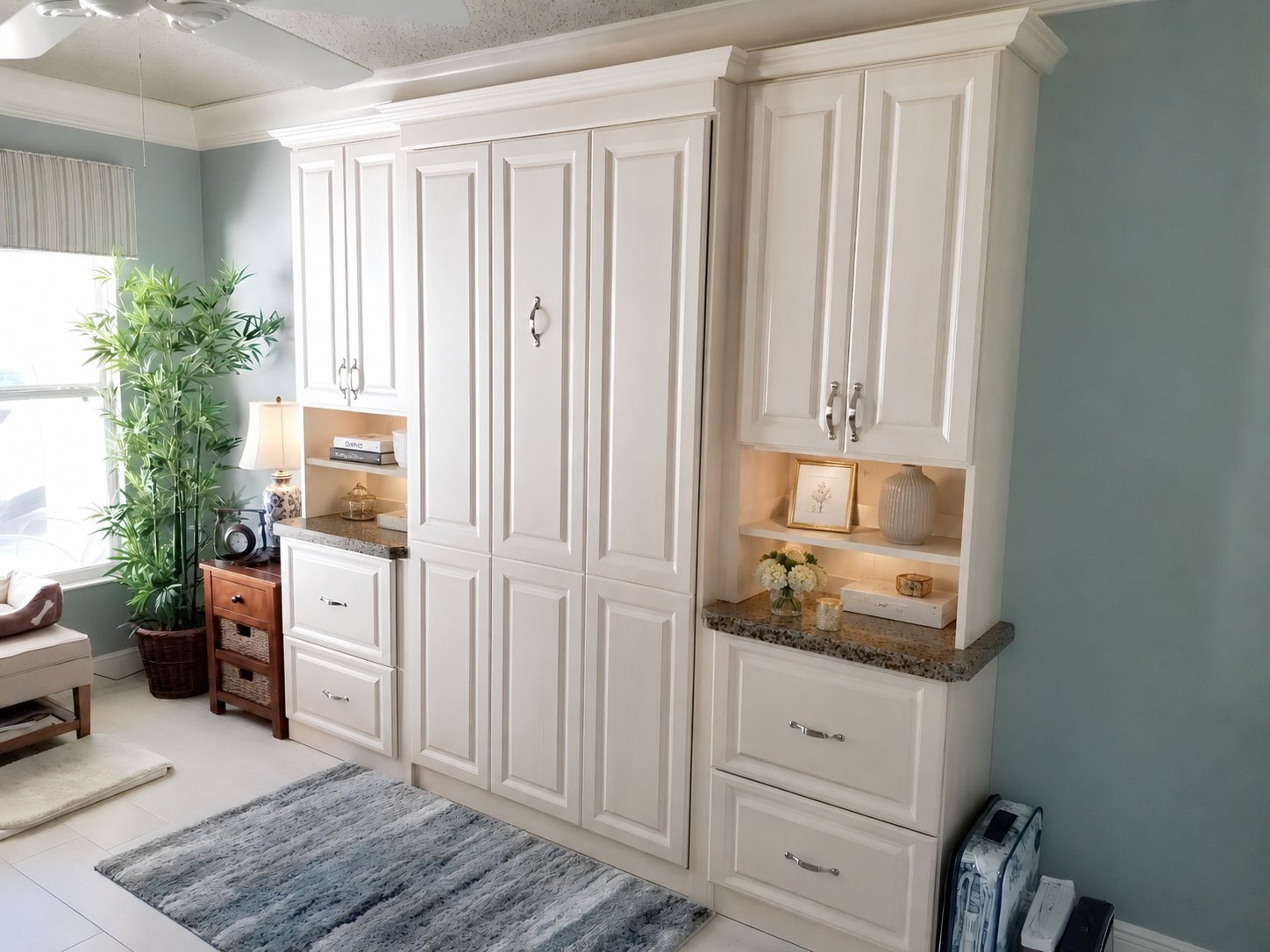 Open built-in wall bed in a bright room with flanking custom cabinetry