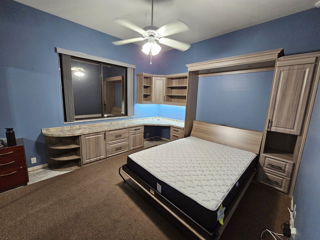 The same wall bed open, ready for guests
