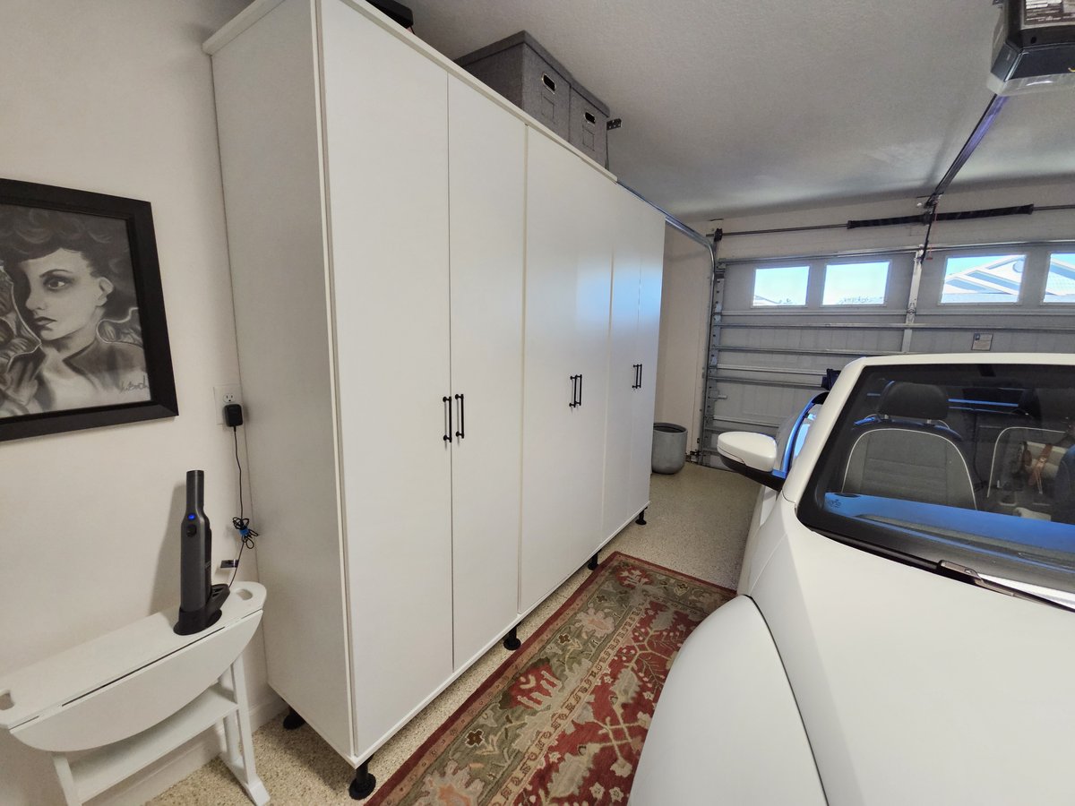Garage cabinets with car and slat-wall storage by Create More Space