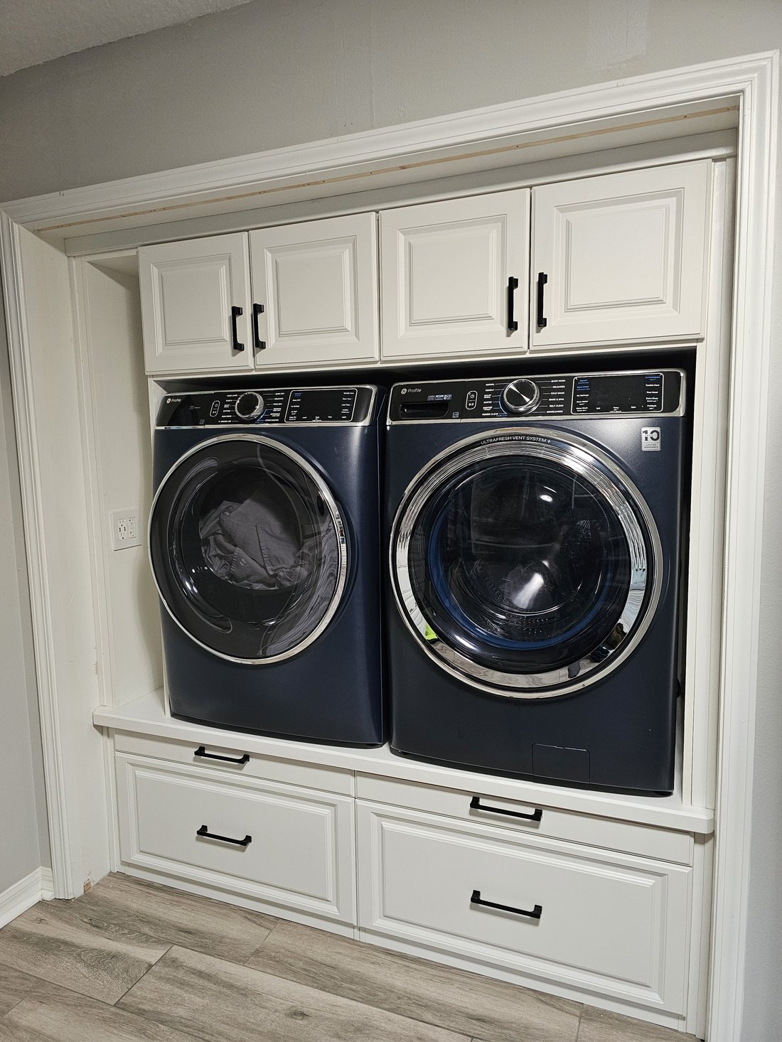 Laundry with stacked washer and dryer surround