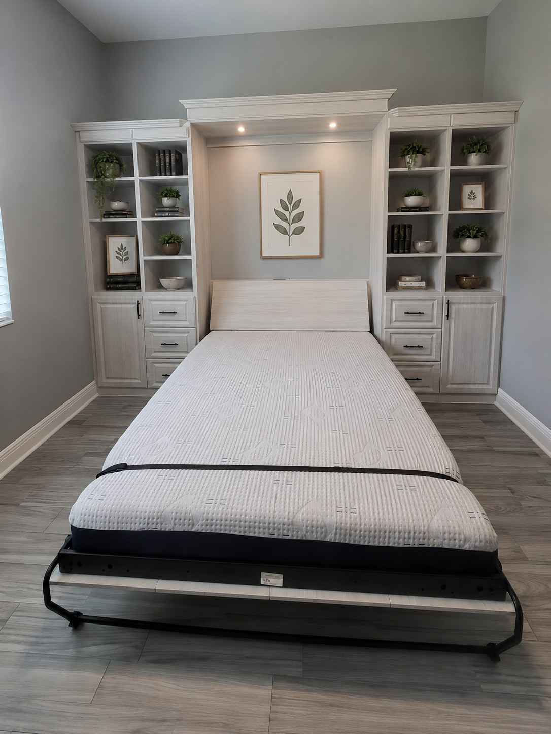 Wall bed open with flanking display shelving by Create More Space